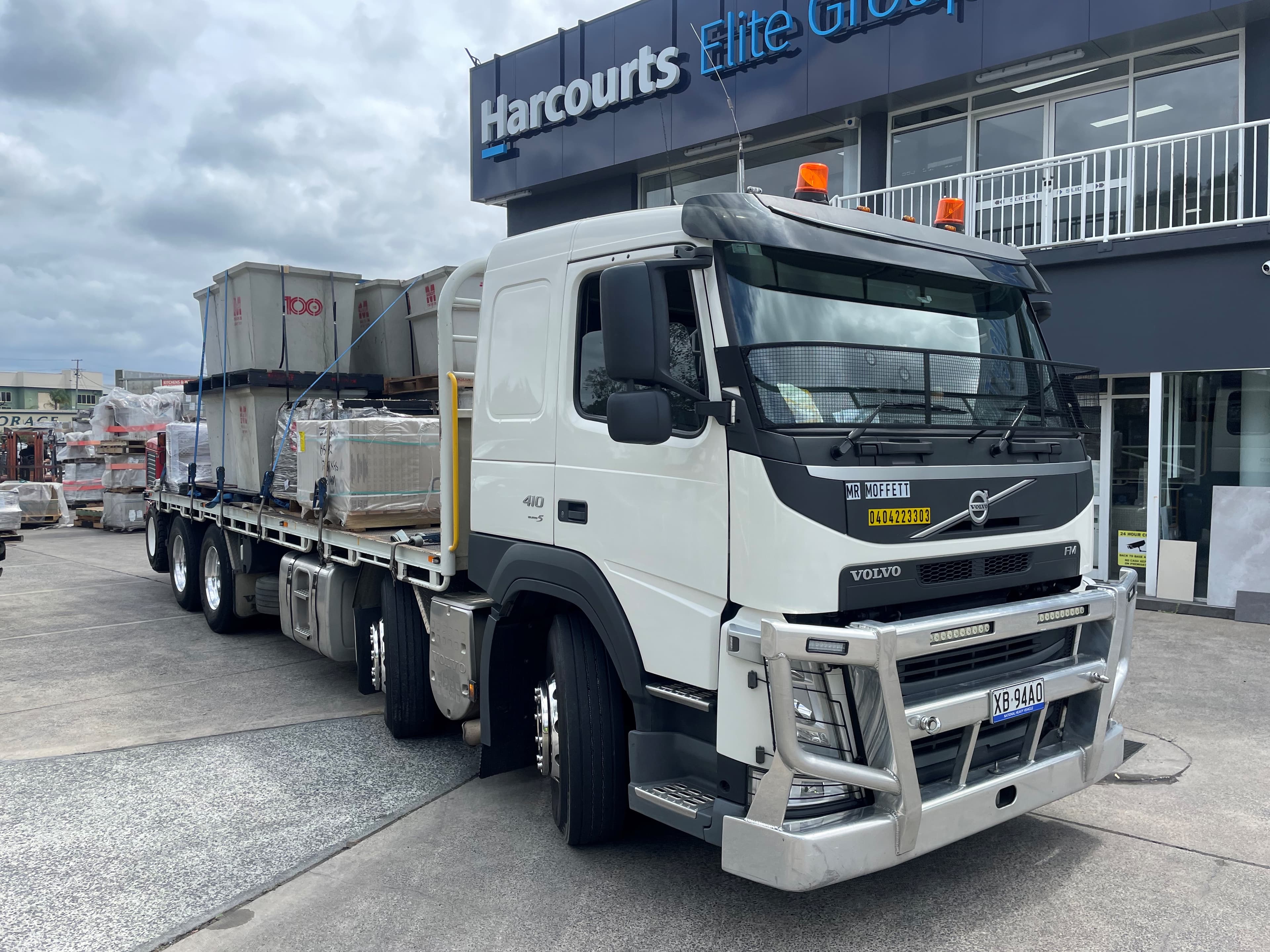 Mr Moffett white Volvo tray truck parked in Brisbane